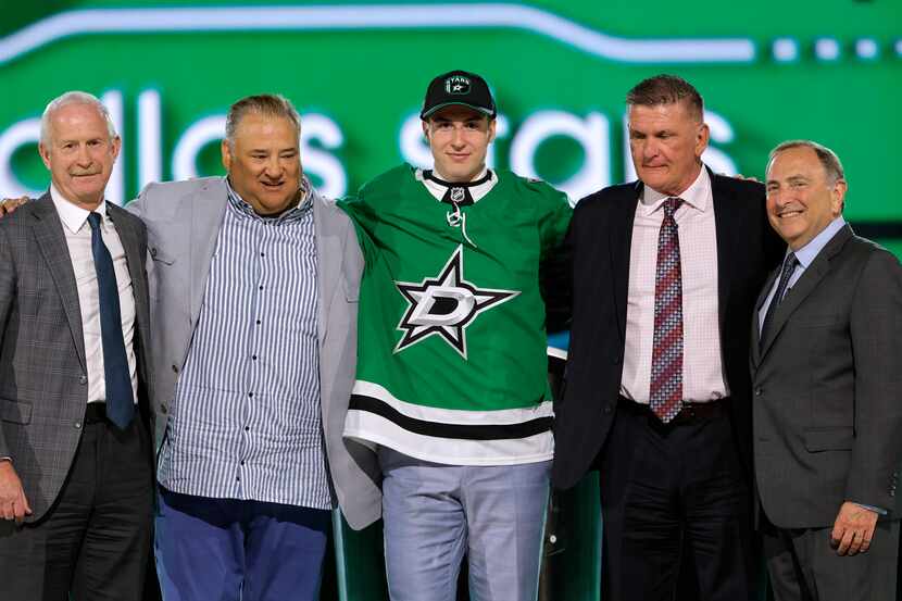 Emil Hemming, center, poses after being selected by the Dallas Stars during the first round...