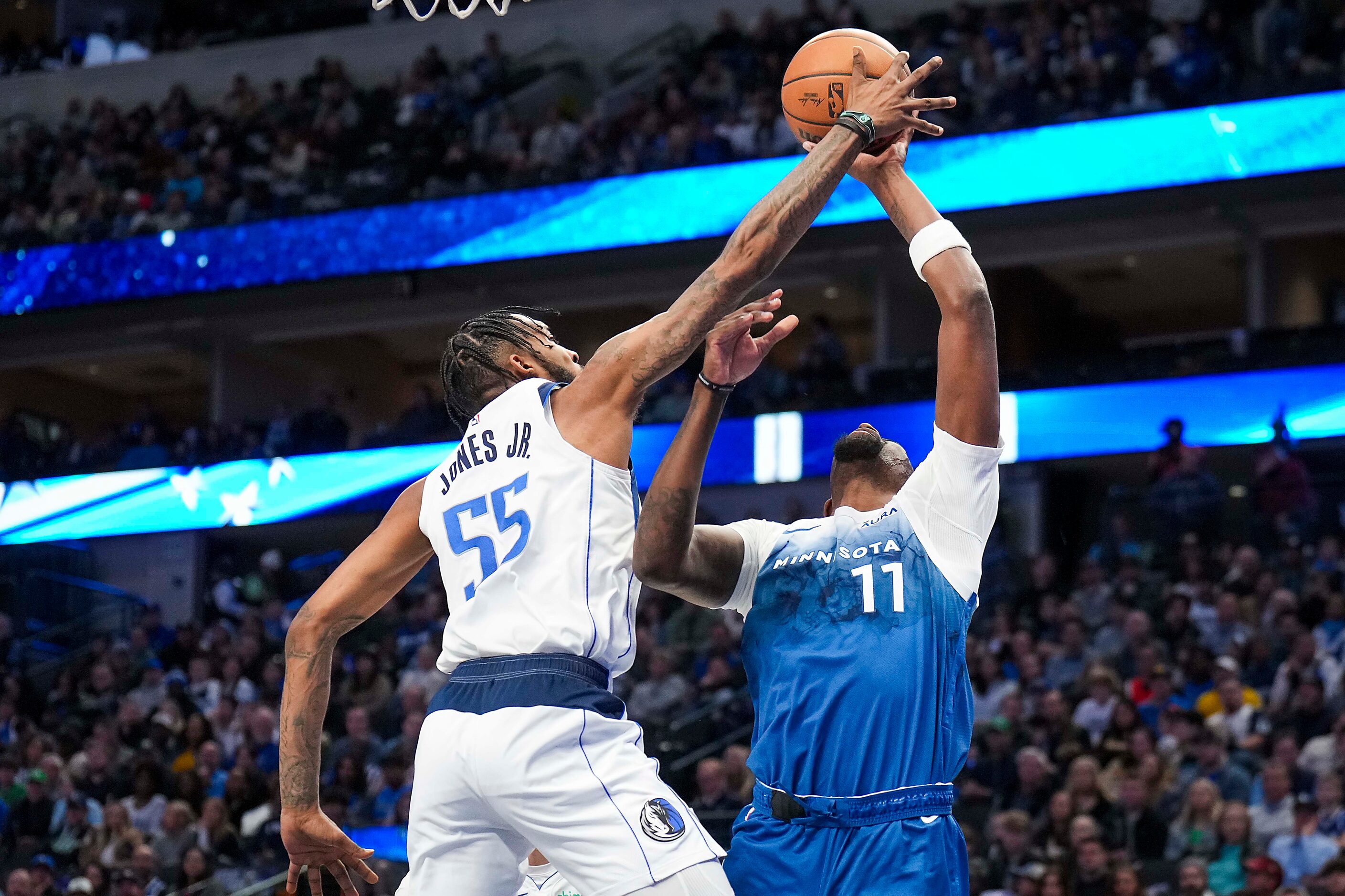 Dallas Mavericks forward Derrick Jones Jr. (55) blocks a shot by Minnesota Timberwolves...