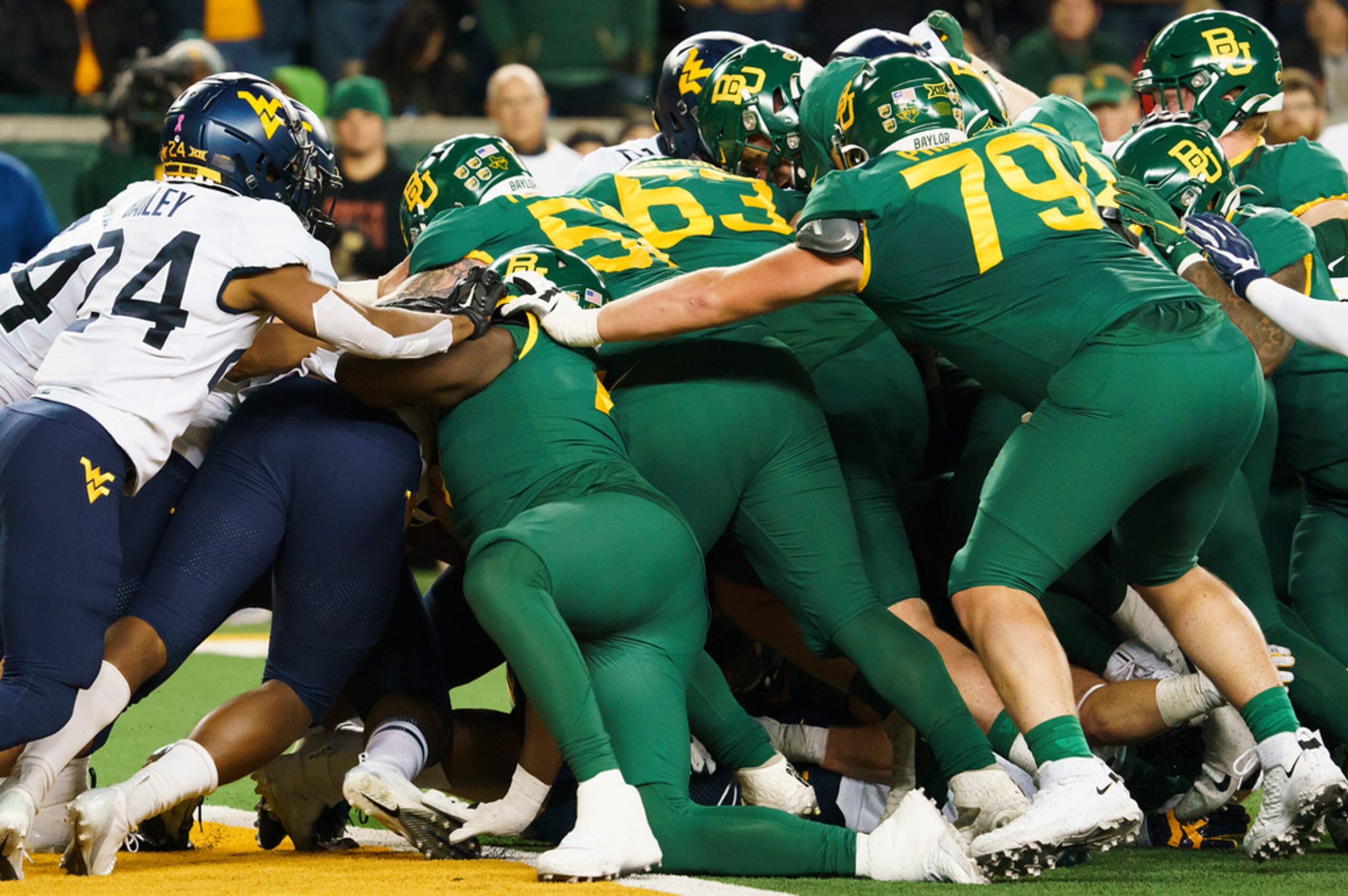 Baylor quarterback Charlie Brewer (12) is stopped short of the end zone on a fourth-and-goal...