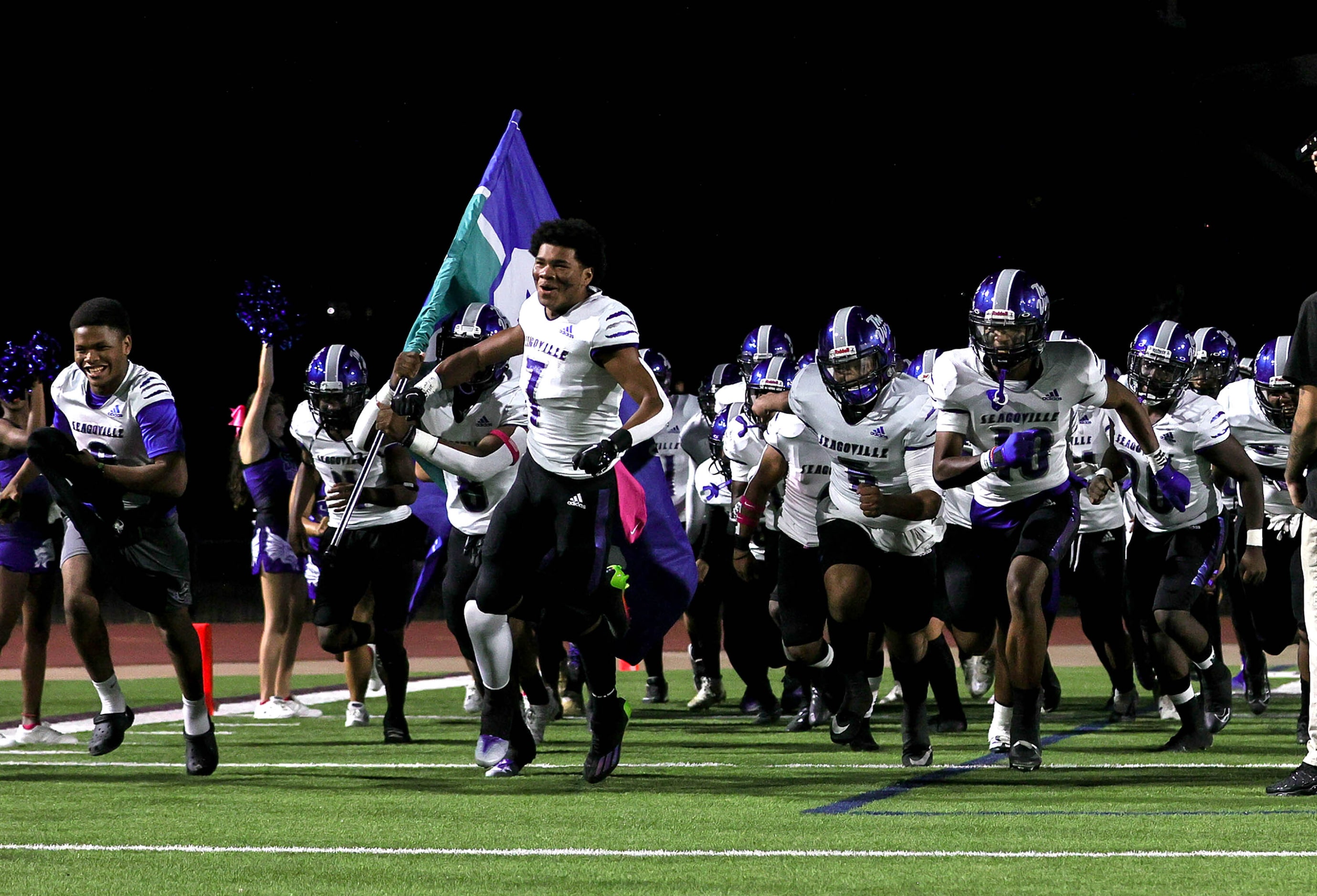 The Seagoville Dragons enter the field to face Thomas Jefferson in a District 6-5A Division...