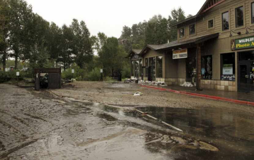 Mud from flooding is shown covering the main street in Estes Park, Colo., on Sept. 15, after...