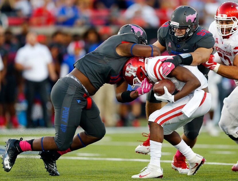 Southern Methodist Mustangs defensive lineman Demerick Gary (10) and defensive end Mason...