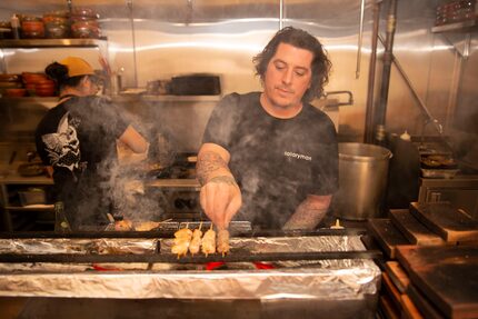 Salaryman chef Justin Holt prepares food in his 27-seat restaurant in December 2019.