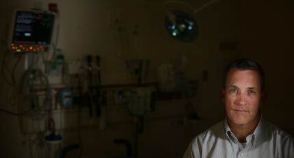 Dr. Stephen Burgher, who is the lead emergency medicine physician, sits for a portrait at...