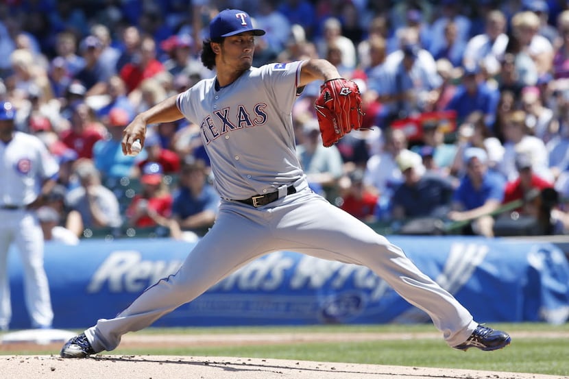 Texas Rangers starter Yu Darvish, of Japan, throws against the Chicago Cubs during the first...