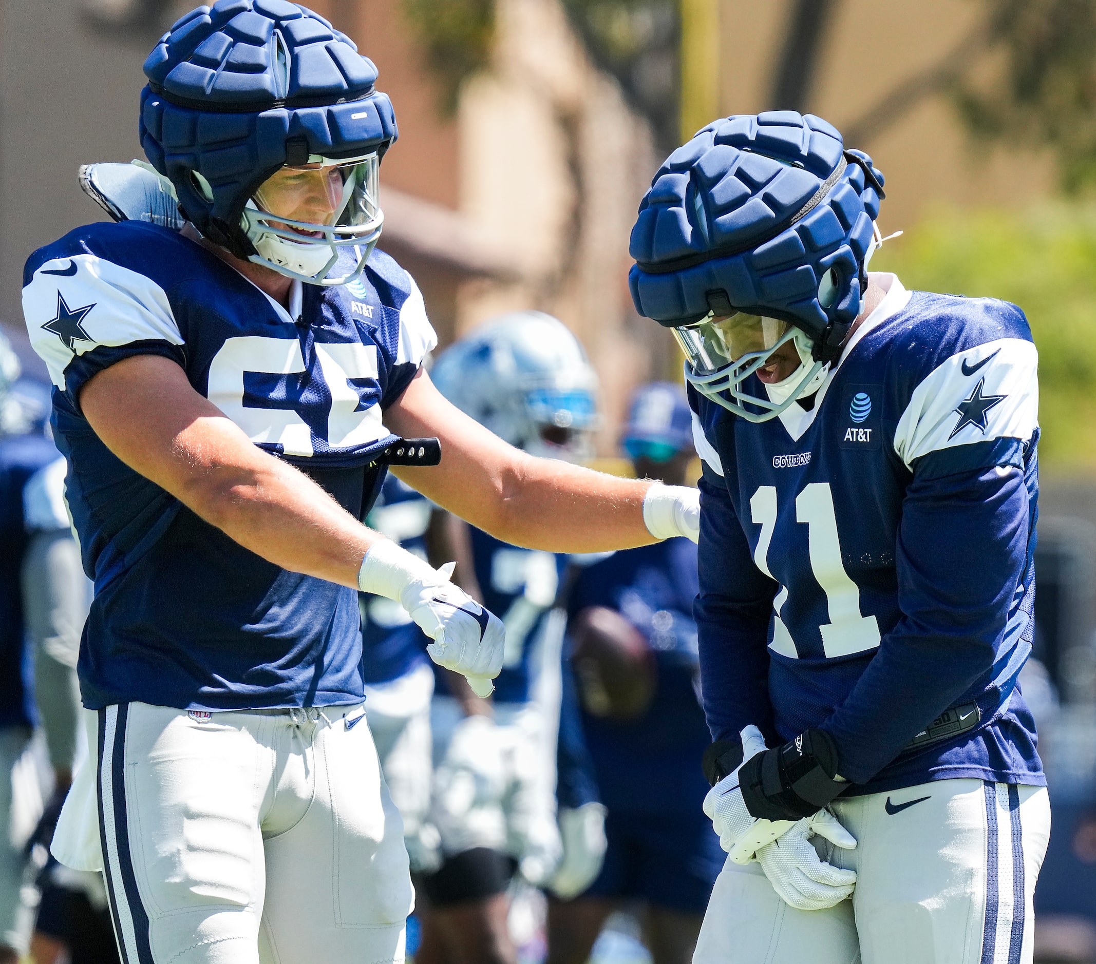 Dallas Cowboys linebacker Micah Parsons (11) clutches his right wrist while participating in...