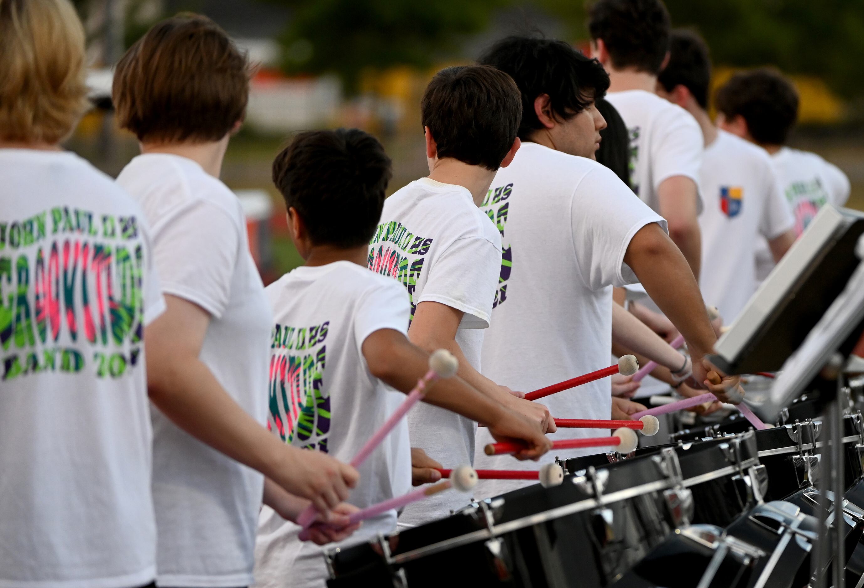 The John Paul II percussion sections plays during a kickoff in the first half of a high...