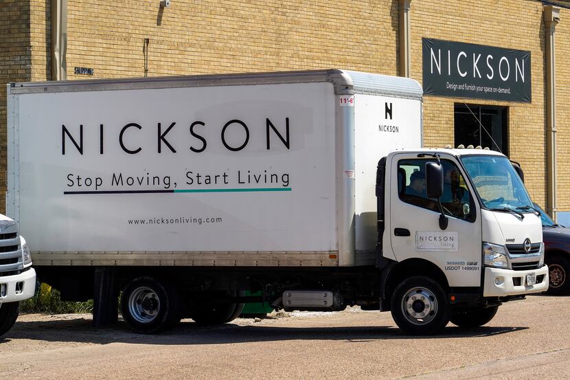 A delivery truck pulls up to the loading docks of the Nickson Furnished offices.
