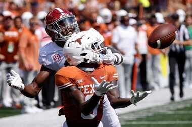 Texas Longhorns wide receiver Xavier Worthy (8) pulls in a long pass and nearly scores...