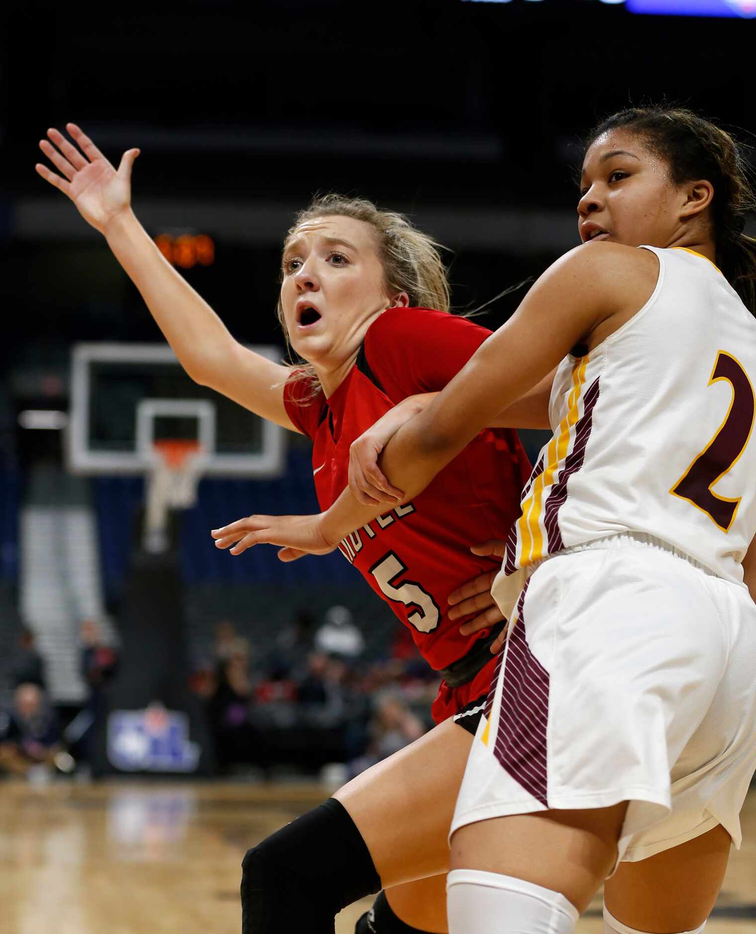 Argyle guard Rhyle McKinney #5 calls for the ball as she is guarded by Fairfield guard Jada...