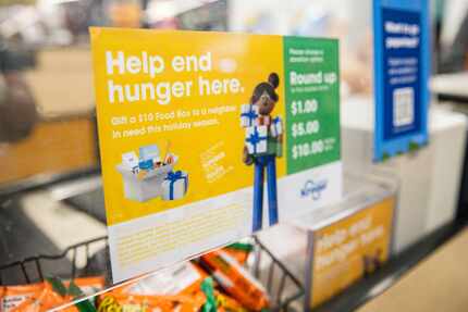 A sticker for Kroger’s "End Hunger Here" campaign placed at a register on Wednesday, Nov....