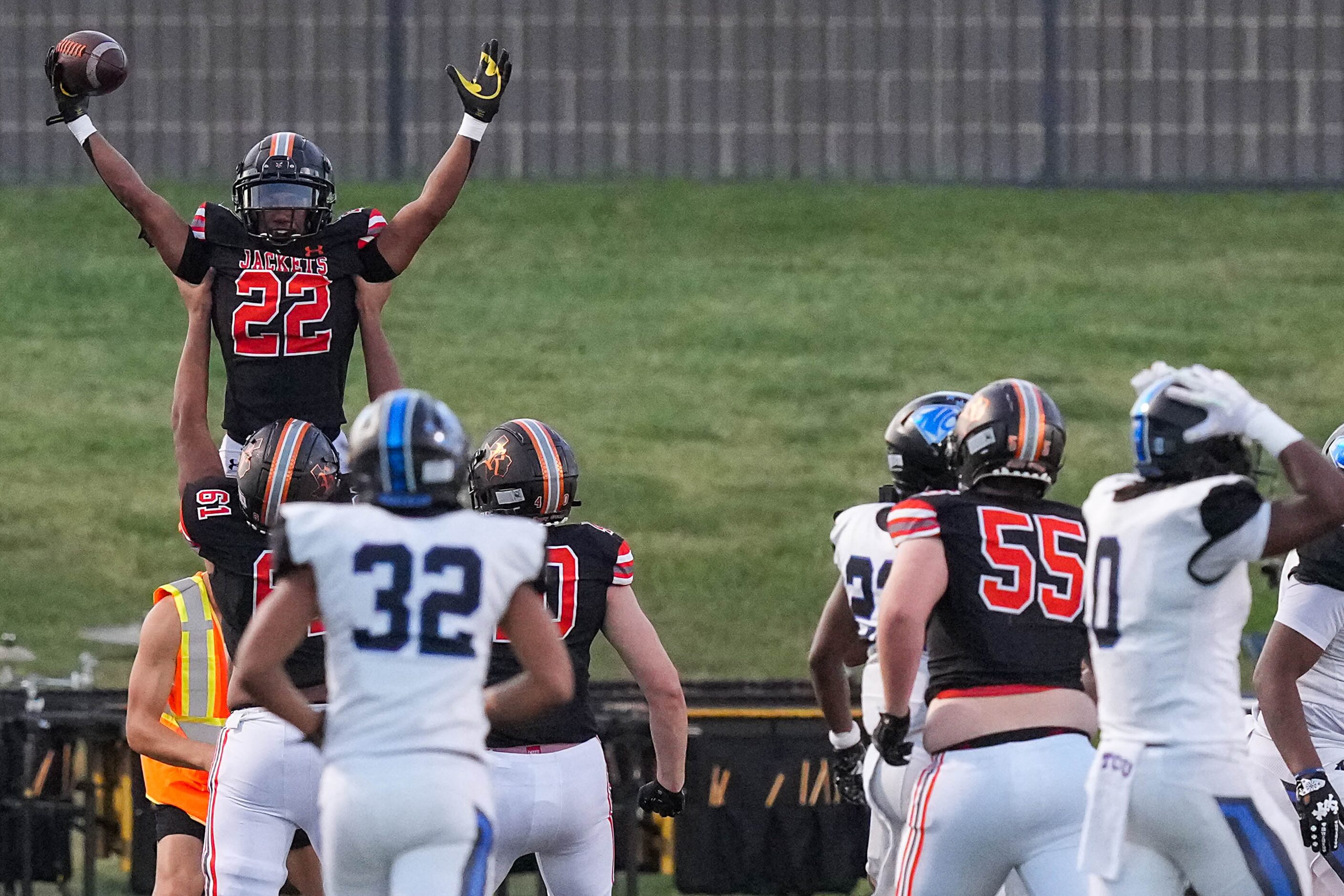 Rockwall running back AJ Hatcher (22) celebrates after scoring a touchdown during the first...