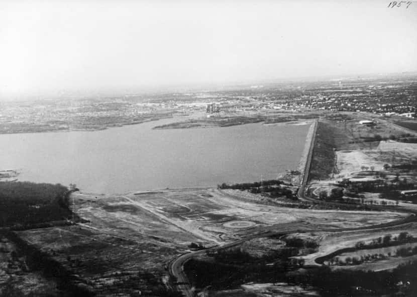 This is a 1957 aerial view of the newly filled Lake Arlington and the Lake Arlington dam....