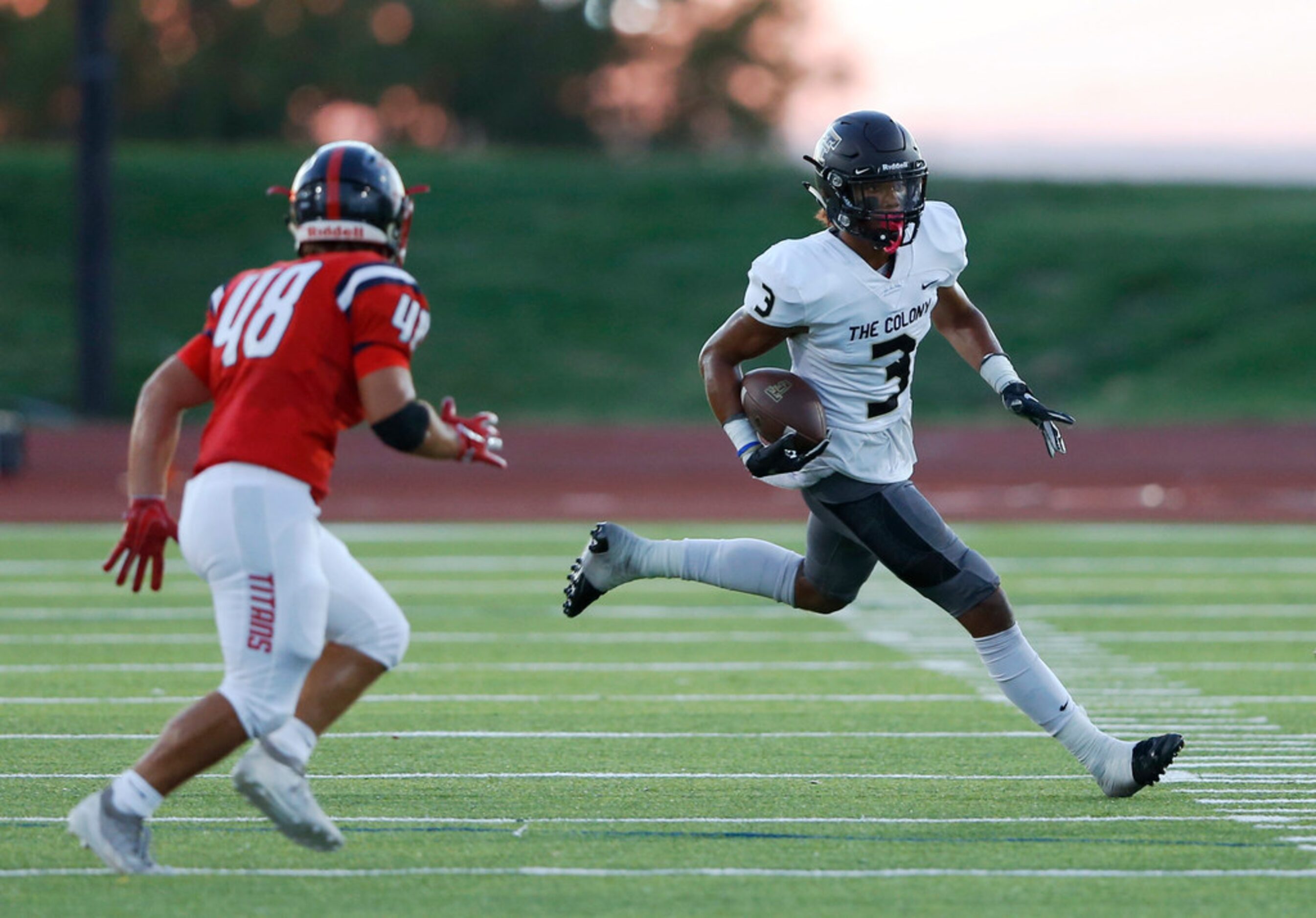 The Colony's Christian Gonzalez (3) runs up the field as Centennial's J.D. Stephens (48)...