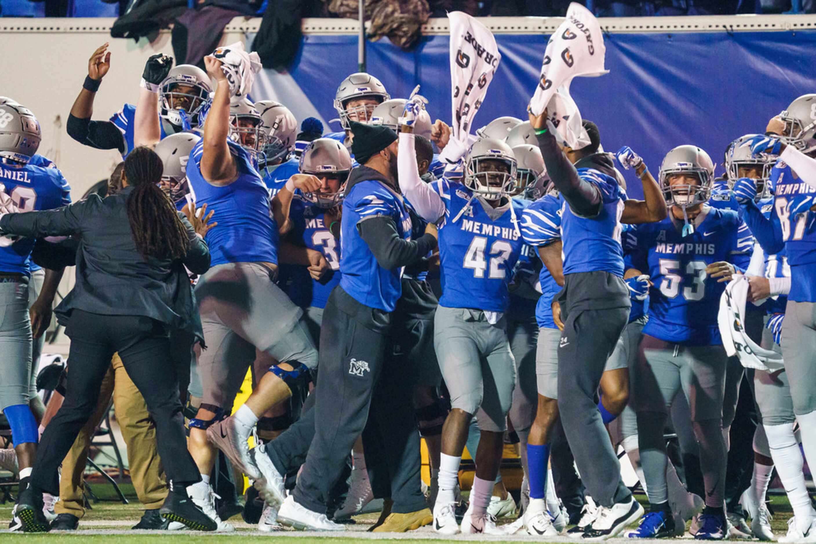 Memphis players whoop it up before the opening kickoff of an NCAA football game against SMU...