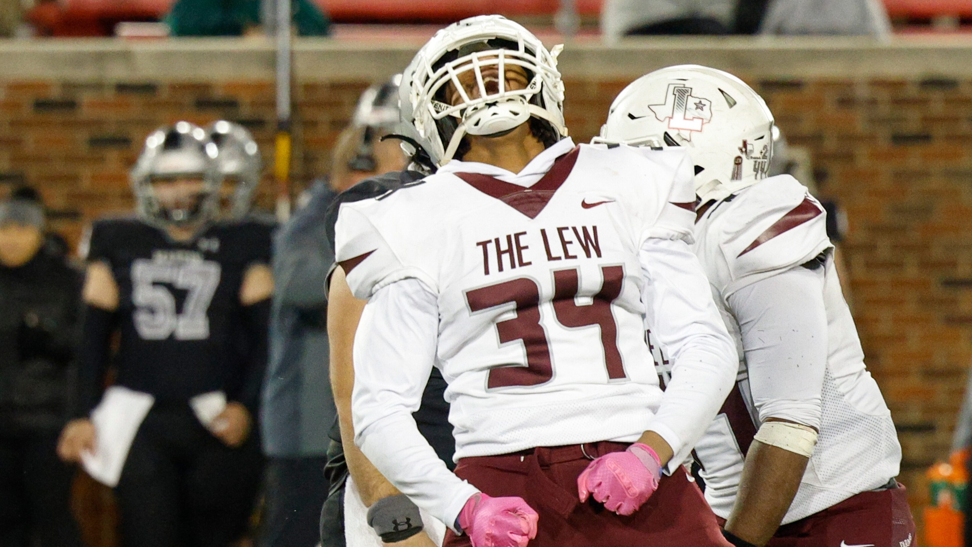 Lewisville defensive lineman Sean Oliver (34) celebrates after sacking Arlington Martin...