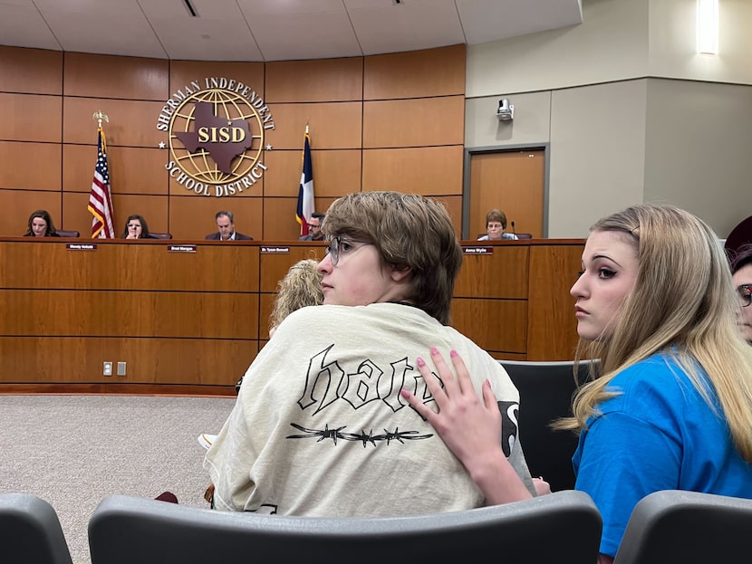 Max Hightower and his sister sit at the Sherman ISD school board meeting on Nov. 13.