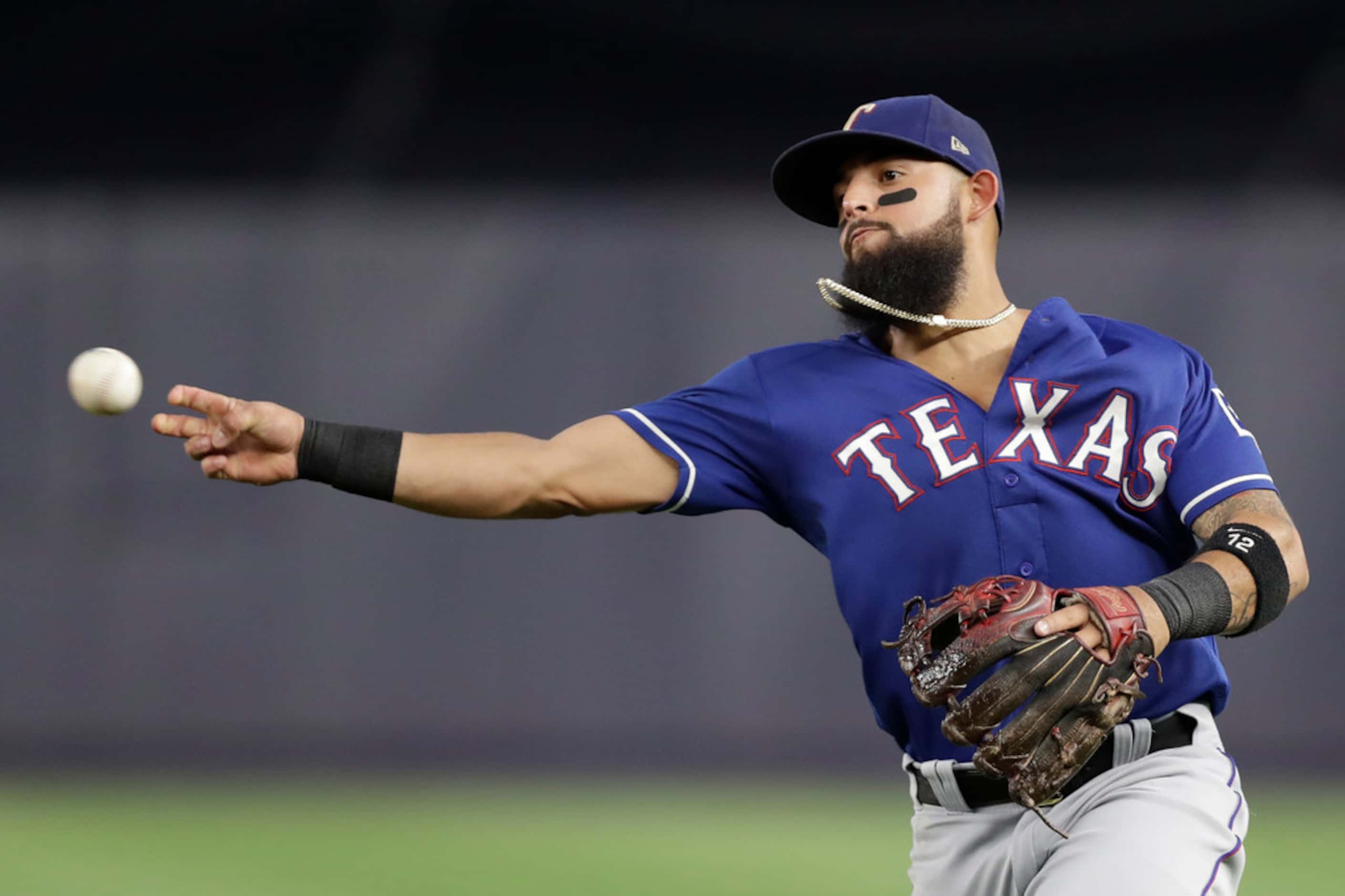 Texas Rangers second baseman Rougned Odor throws on a play during a baseball game against...