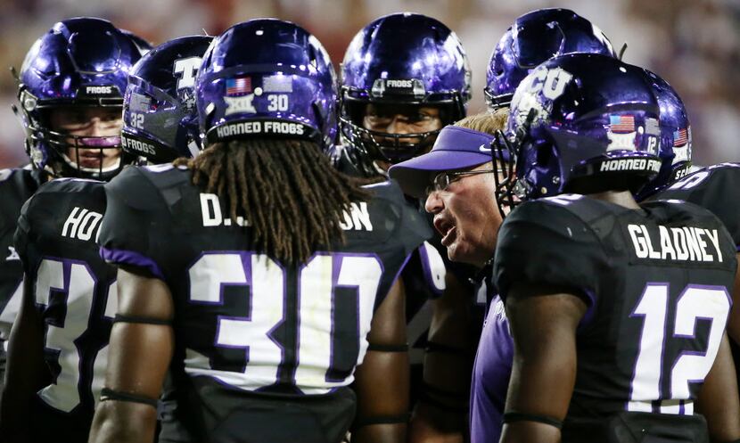 TCU head coach Gary Patterson talks to his players in the second half during an NCAA...