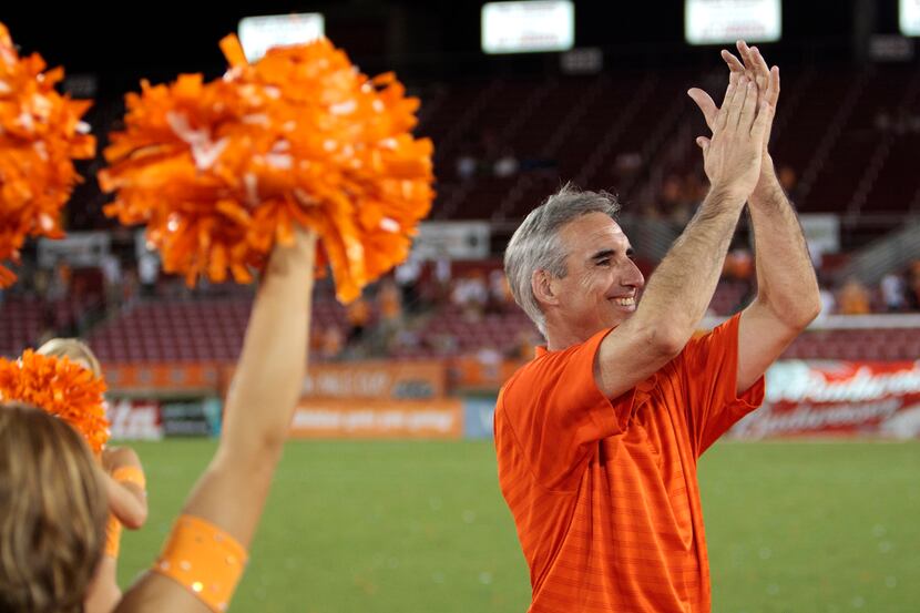 Houston Dynamo President and General Manager Oliver Luck applauds the fans after the game at...