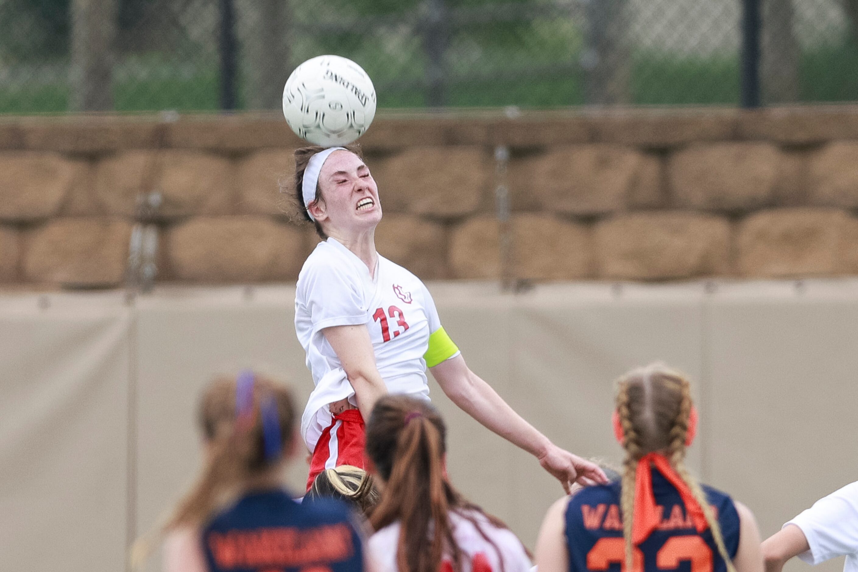 Grapevine midfielder Kasten Merrill (13) elevates for a header during overtime of the Class...