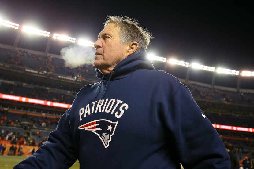 DENVER, CO - DECEMBER 18:  Head coach Bill Belichick of the New England Patriots walks off...
