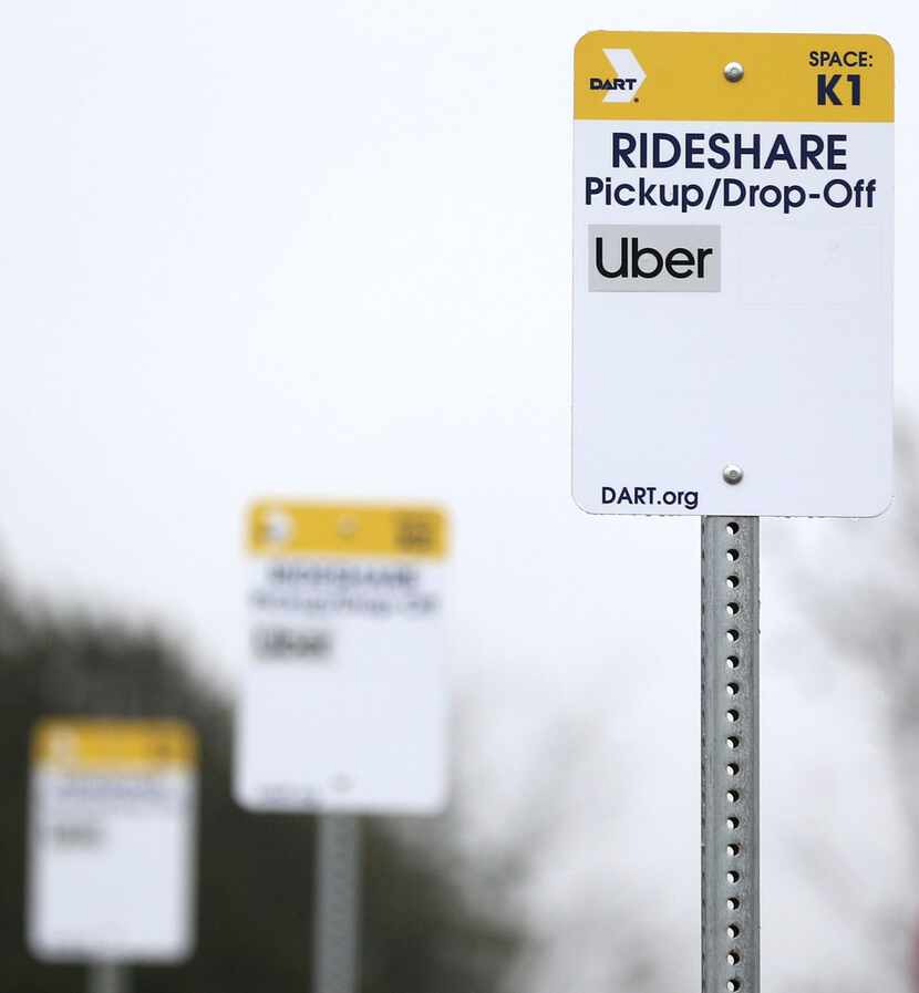 Dallas Area Rapid Transit has put up ride-share signs at the UNT Dallas Station in Dallas...