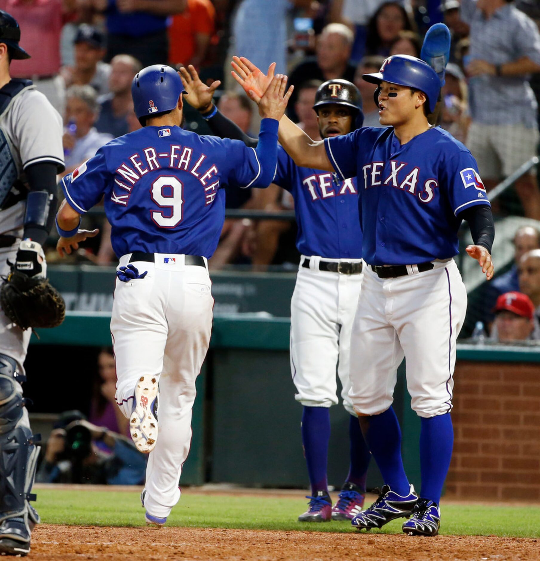 Texas Rangers' Isiah Kiner-Falefa (9), Delino DeShields, center, and Shin-Soo Choo, right,...