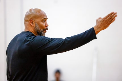 Duncanville boys head basketball coach David Peavy talks to the team during a practice,...