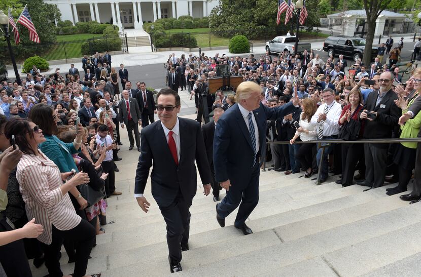 President Donald Trump and Treasury Secretary Steven Mnuchin arrive at the Treasury...