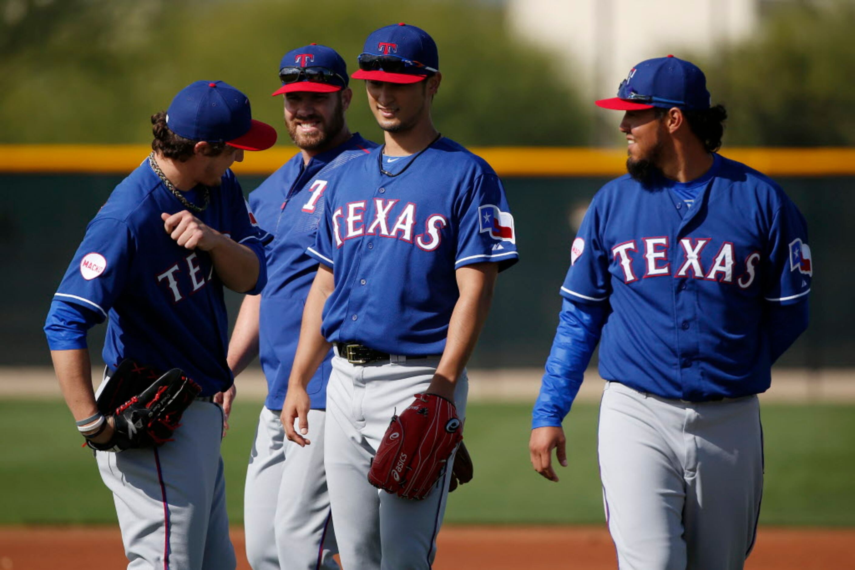 Texas Rangers starting pitcher Derek Holland (45) delivers to the