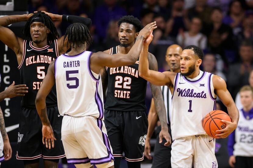 Kansas State guard Markquis Nowell (1) is congratulated by Kansas State guard Cam Carter (5)...