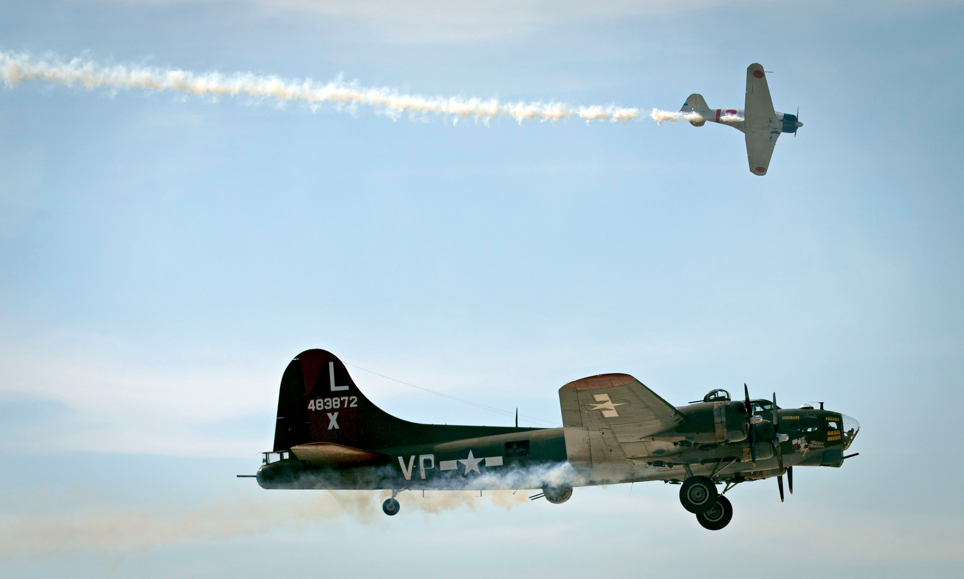 A B-17 and Japanese Zero airplane fly during the Commemorative Air Force Wings Over Dallas...