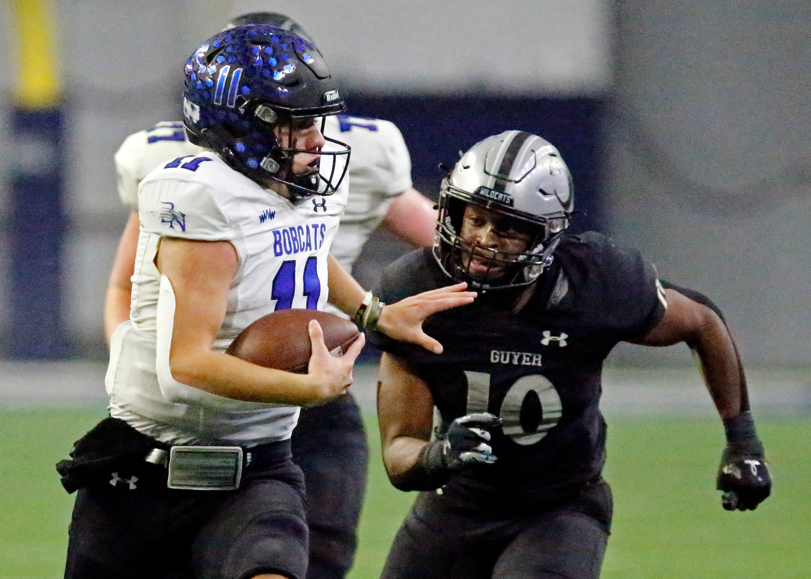 Byron Nelson High School quarterback Jake Wilson (11) runs for a long gain as Guyer High...