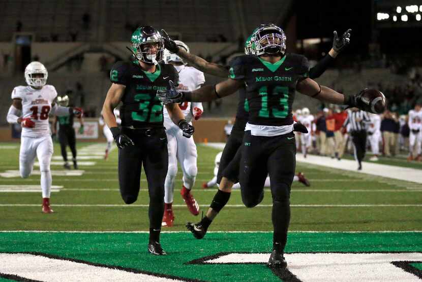 FILE - North Texas Mean Green running back DeAndre Torrey (13) outraced the Florida Atlantic...