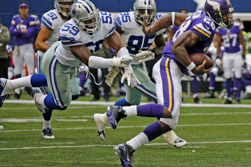 Minnesota Vikings running back Adrian Peterson (28) breaks away from Dallas Cowboys inside...