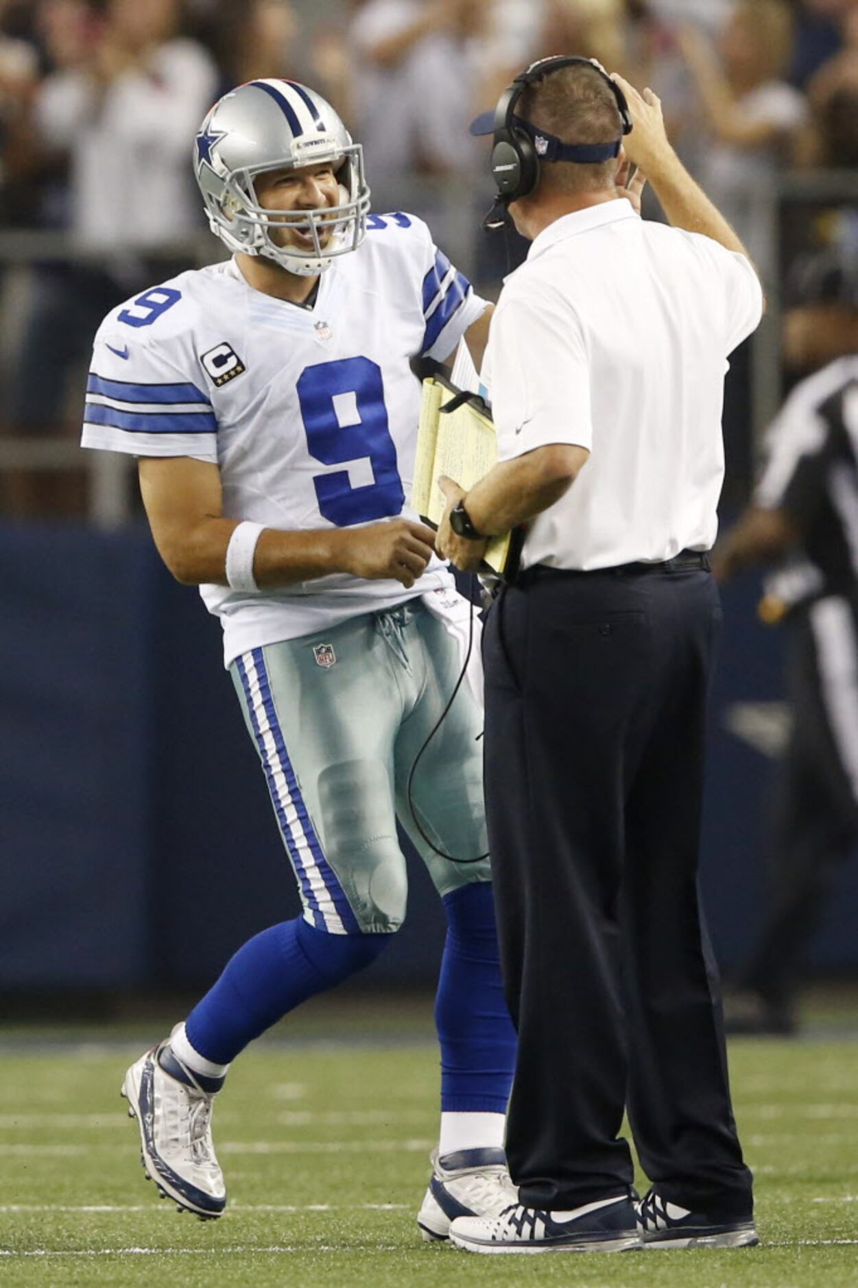 Dallas Cowboys quarterback Tony Romo (9) celebrates with Dallas Cowboys passing game...