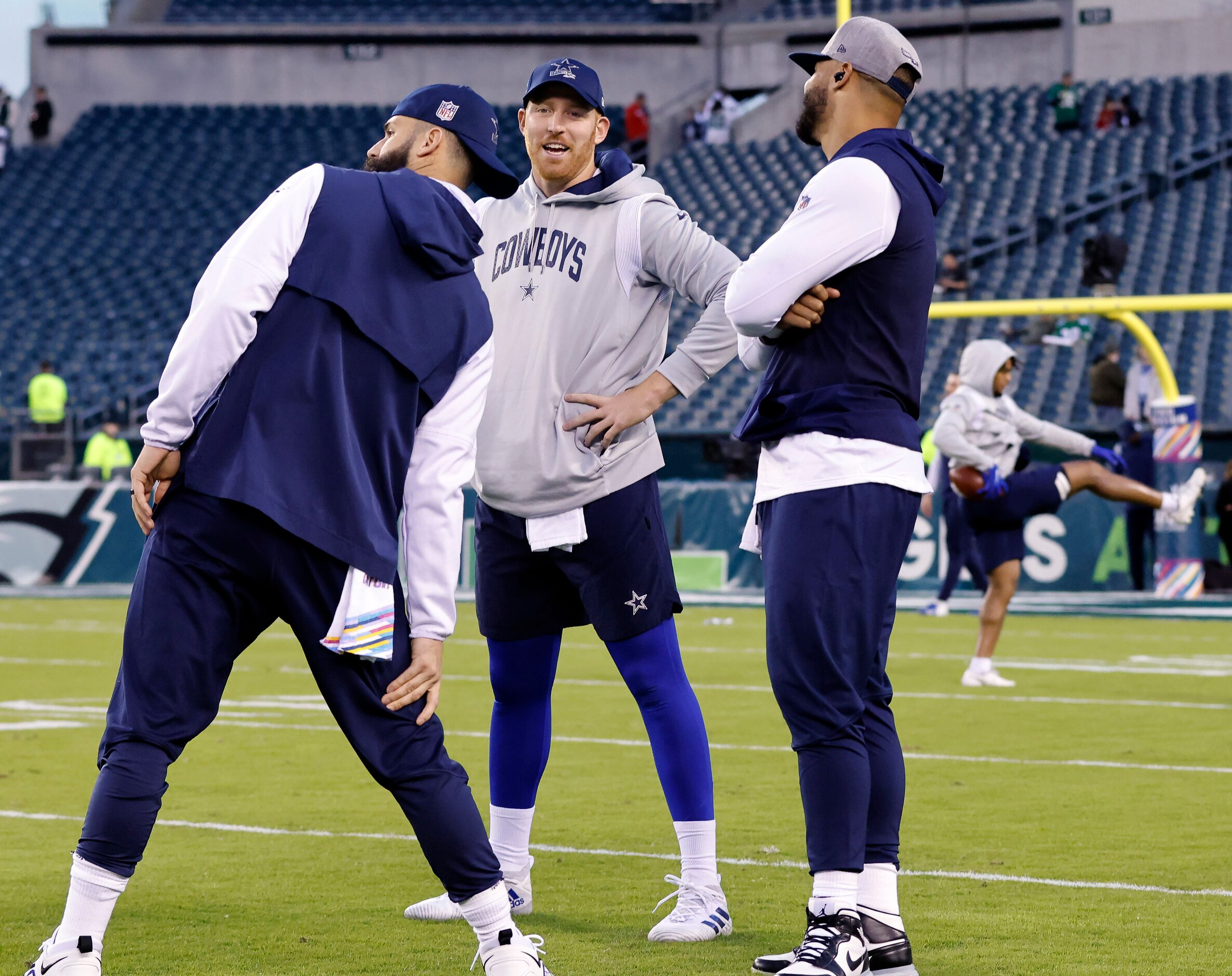 Dallas Cowboys quarterbacks Will Grier (left) Cooper Rush (center) and Dak Prescott visit...