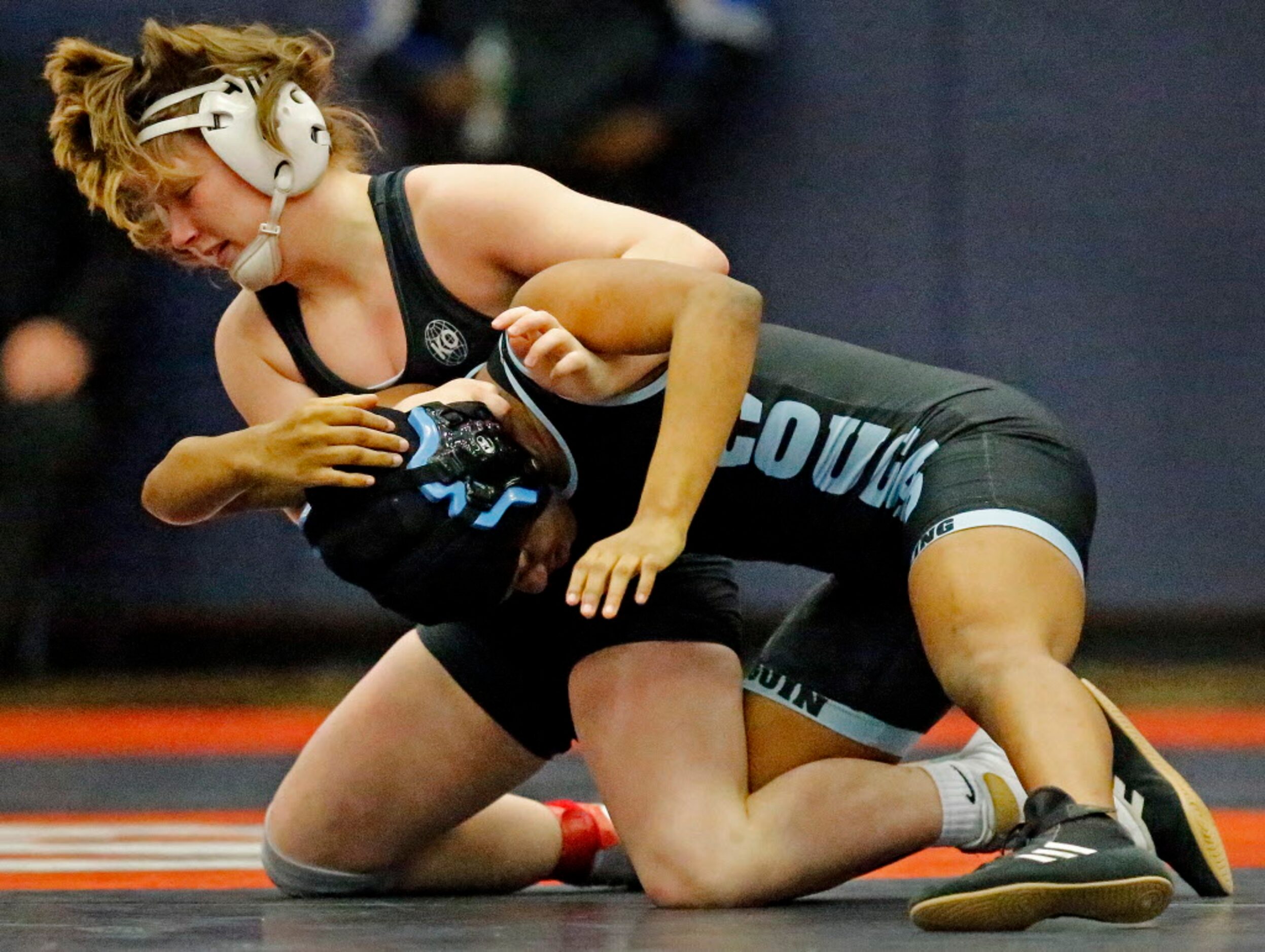 Ashley Cook (top) of Frisco Liberty High School competes with Armani Barnes of Arlington...