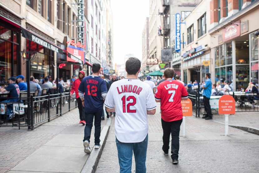 Fans head to Progressive Field before the start of Game 7 of the World Series between the...