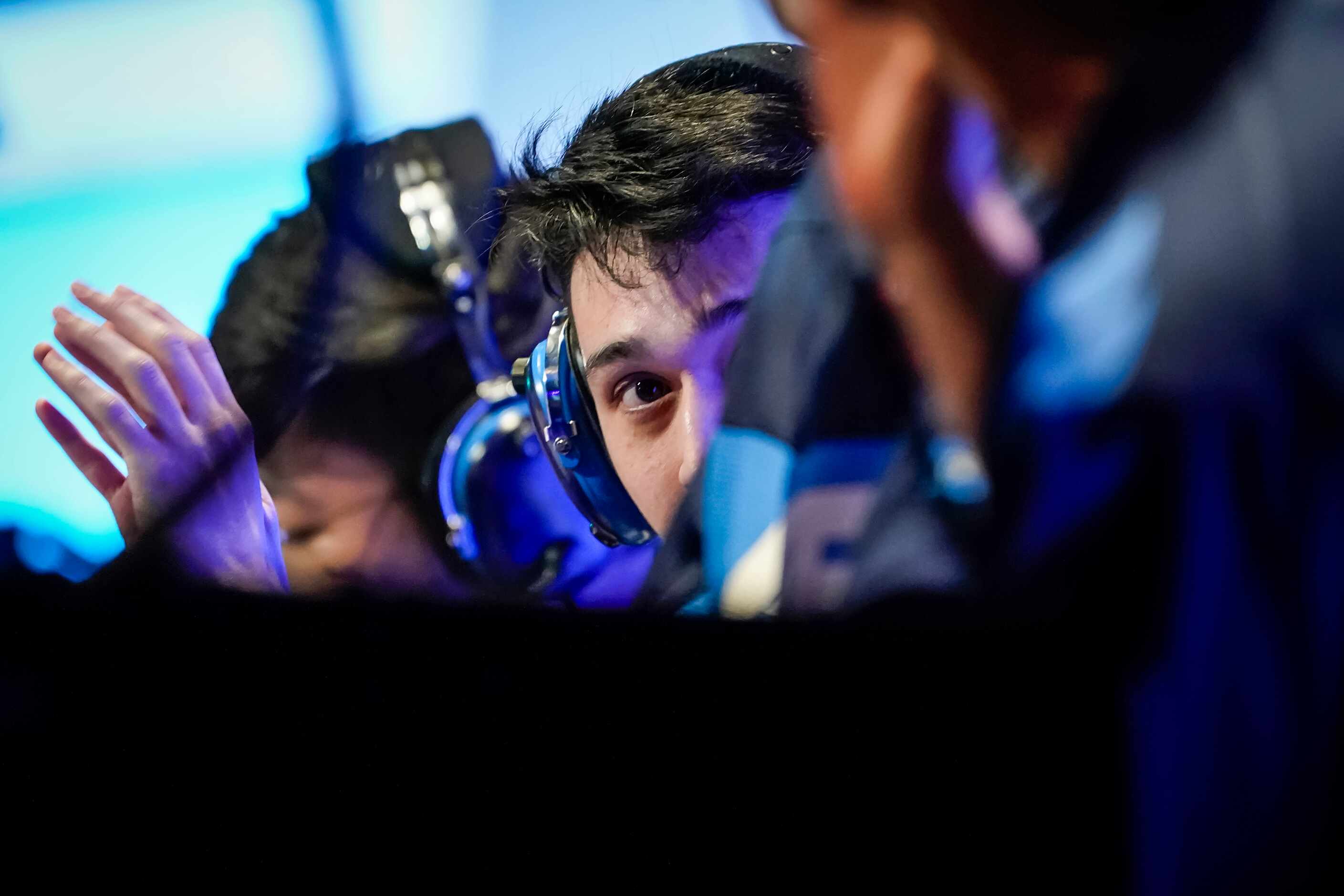 Ash "Trill" Powell of the Dallas Fuel talks with teammates before the start of a Overwatch...