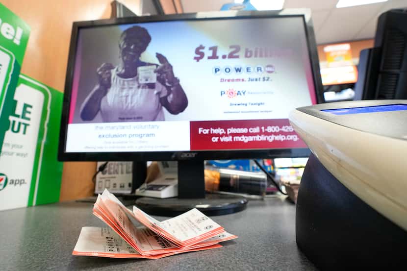 Used lottery playslips are seen on a counter in a convenience store, Wednesday, Nov. 2,...