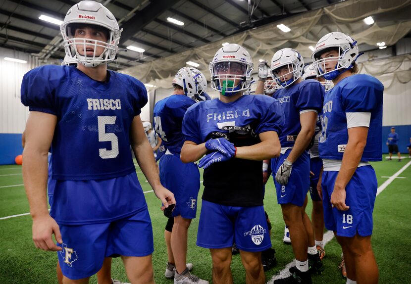 Frisco High running backs Bradford Martin (left), Dylan Hardin (center) and quarterback...