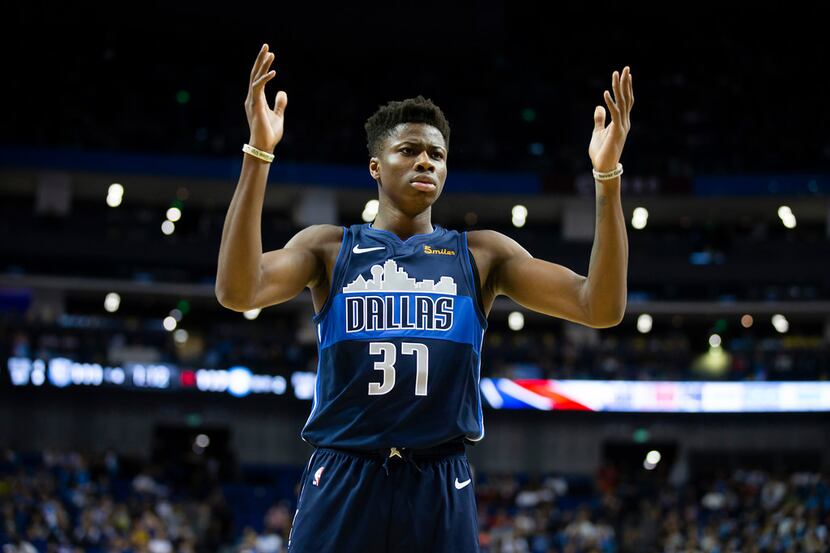 Dallas Mavericks forward Kostas Antetokounmpo reacts after being called for a foul during...