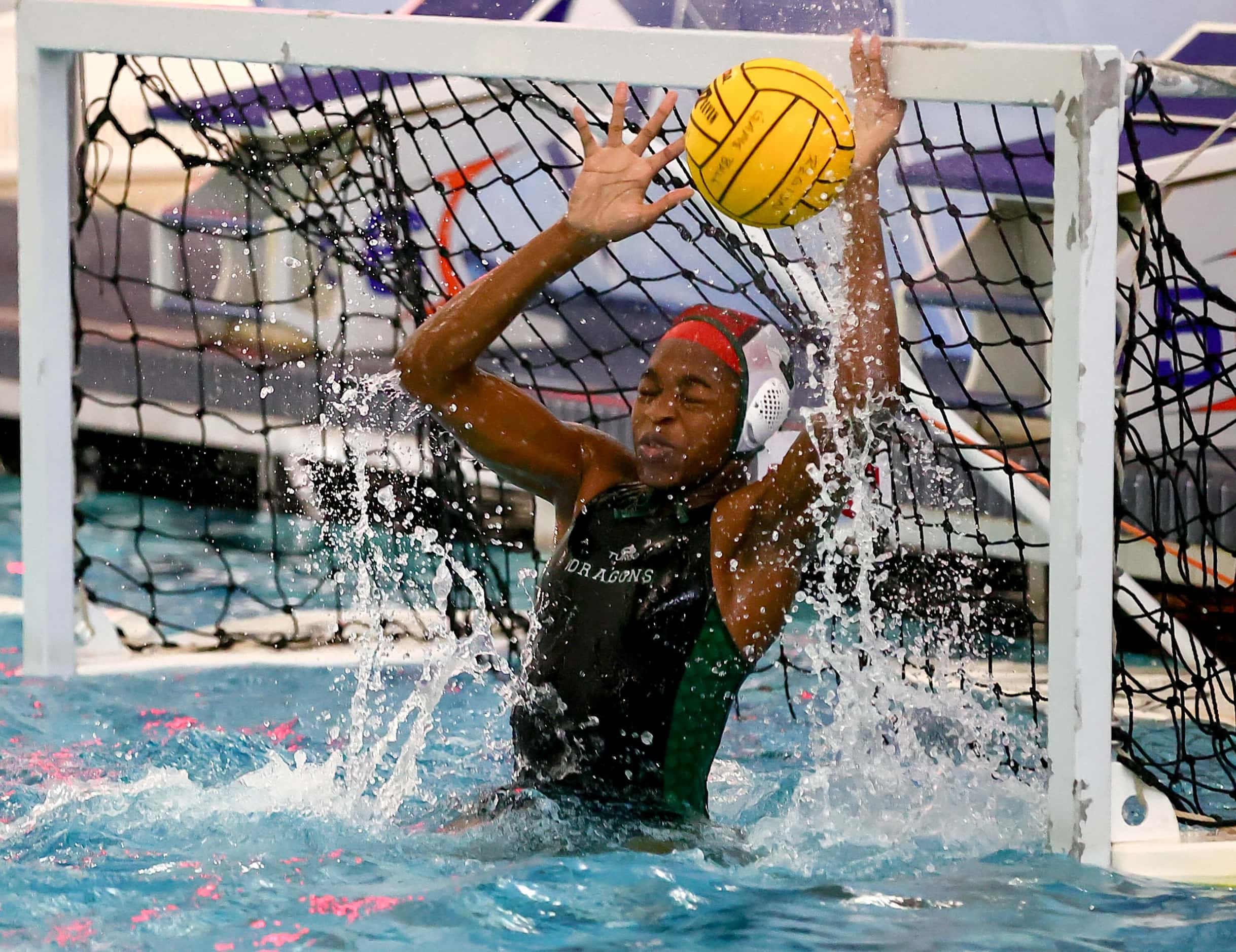 Southlake Carroll goal keeper Somto Okafo makes a great save against Hebron in the 6A Region...