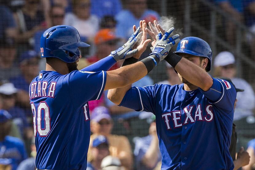 Texas Rangers outfielder Nomar Mazara  celebrates with third baseman Joey Gallo after both...
