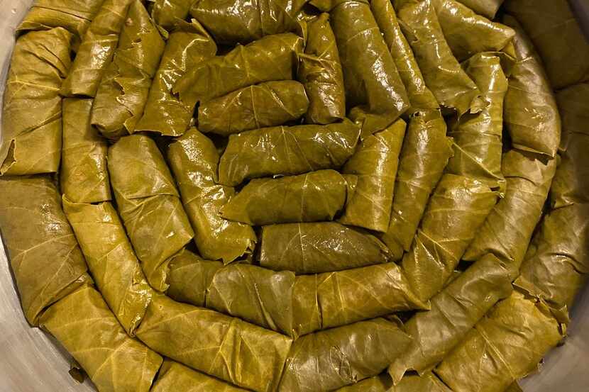 Dolmades, or stuffed grape leaves, are hand-rolled and steamed at the new McKinney...