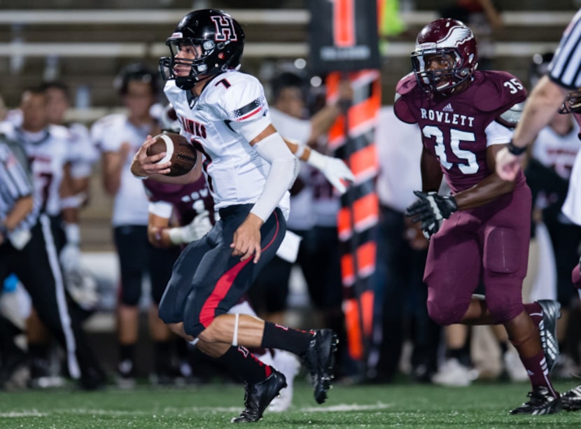 Rockwall-Heath junior quarterback Jordan Hoy runs down the field against Rowlett on Sept....