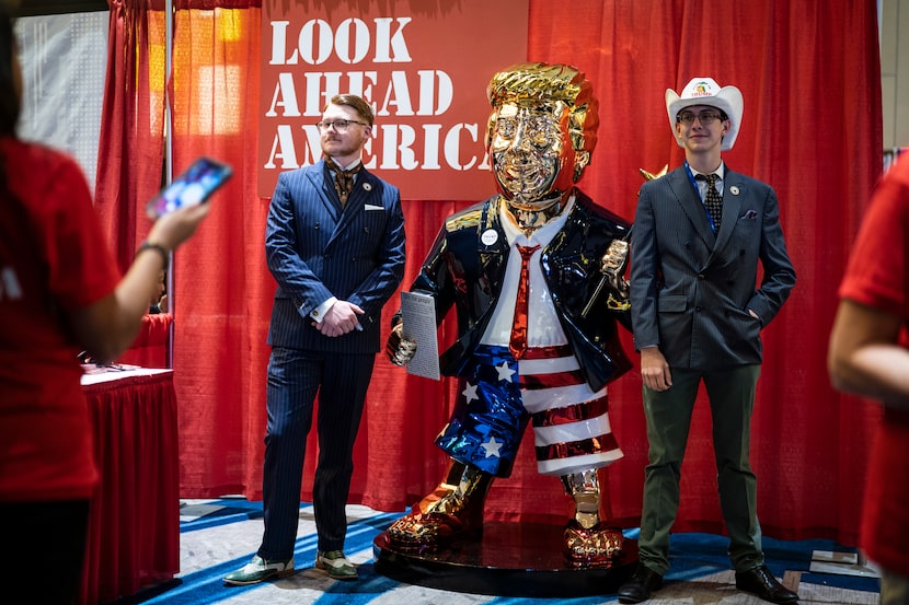 Attendees at the Conservative Political Action Conference in Orlando posed with a golden...