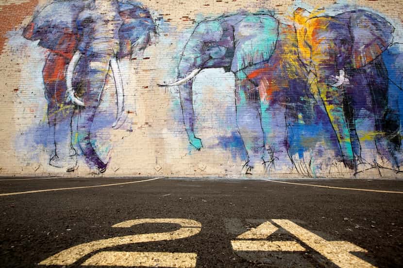  Artist Adrian Torres' mural, Deep Ellumphants, at Main St. and Exposition Ave. (Tom Fox/The...